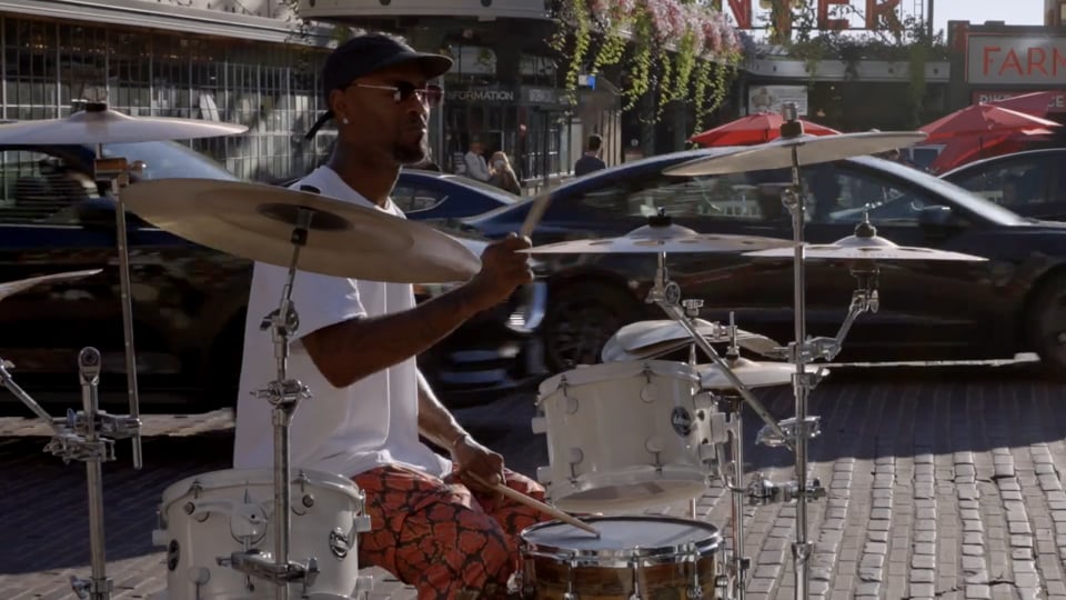Street drummer performing in downtown Seattle for Downtown Seattle Association