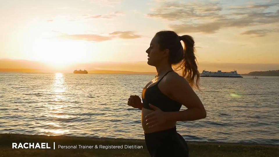 Space Needle Skyrisers campaign — trainer Rachael running the Seattle waterfront at sunset